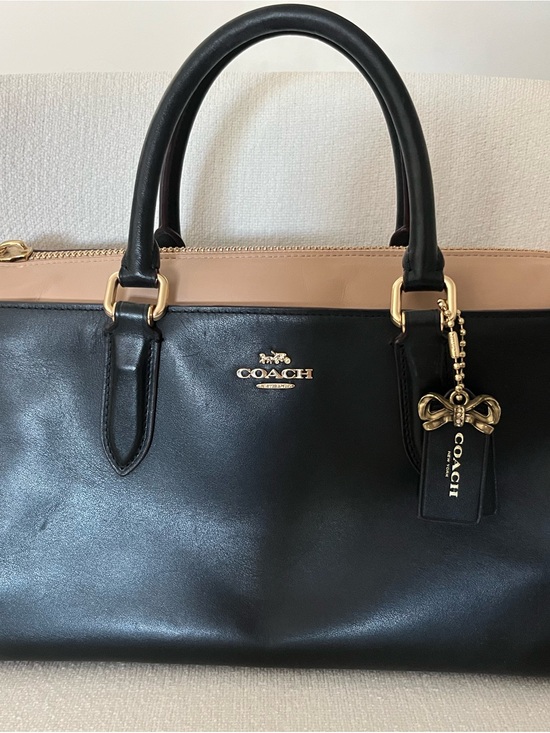Coach Handbags - COACH Black and Beige Leather Bow Charm Satchel